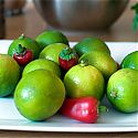 A plate of limes and peppers